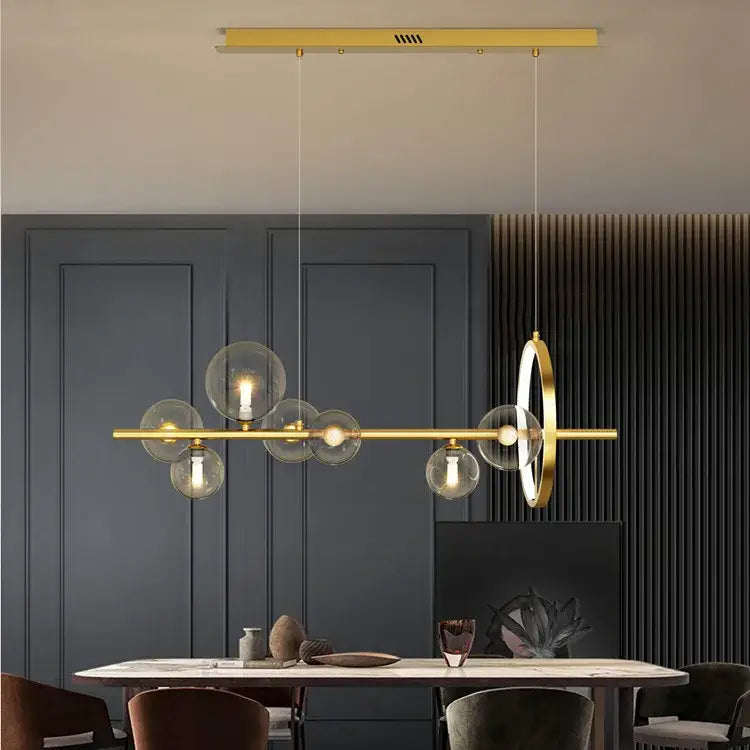 Modern gold-toned DecorBites™ nordic glass bubble LED chandelier with clear glass globe bulbs and circular accent piece