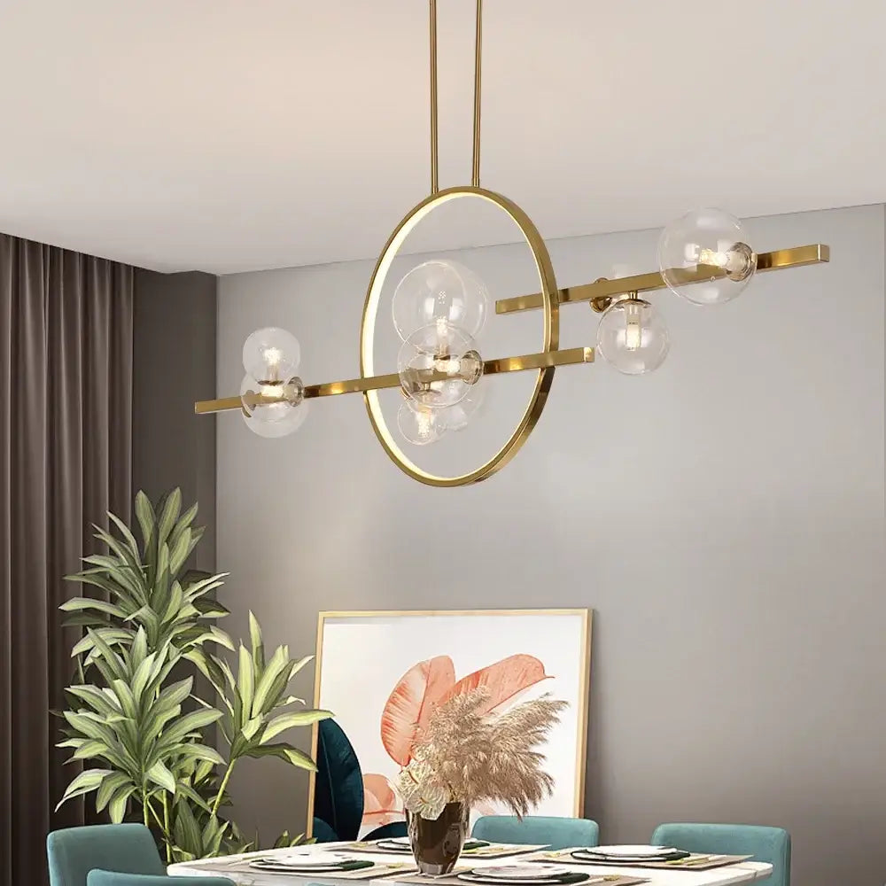 Modern gold-toned nordic glass bubble led chandelier with clear glass globe bulbs and sleek geometric design by DecorBites