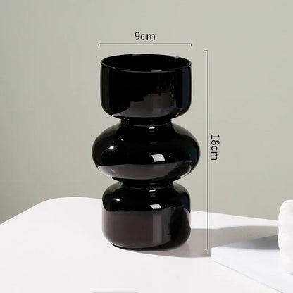 A sleek glossy black ceramic vase with modern stacked design perfect for vase home decor by DecorBites™ Nordic Glass Flower Vase