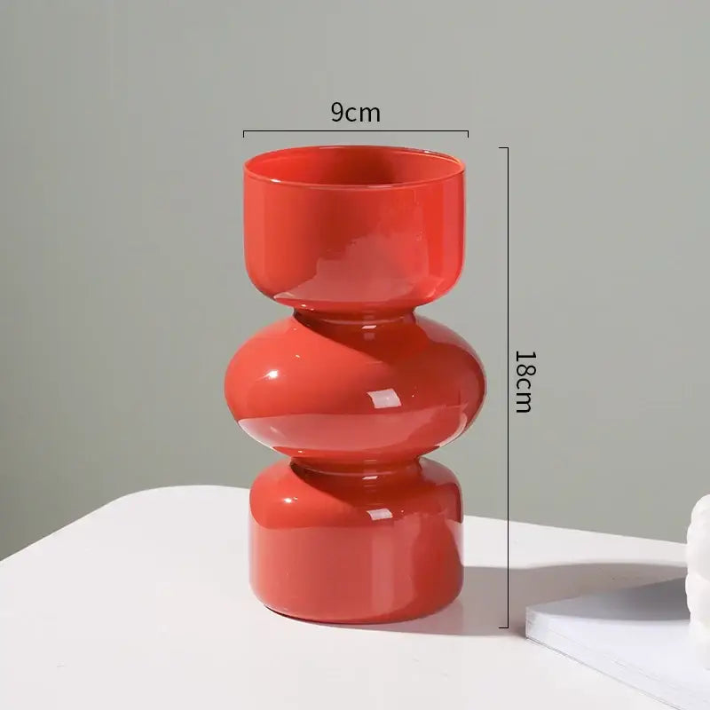 Vibrant coral-colored glossy ceramic vase with stacked rounded segments for elegant vase home decor