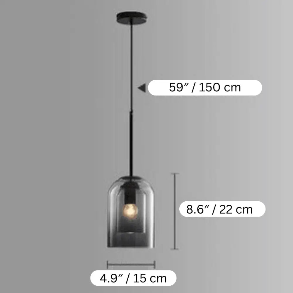 Modern black nordic glass pendant light with clear bell-shaped shade and exposed bulb by DecorBites