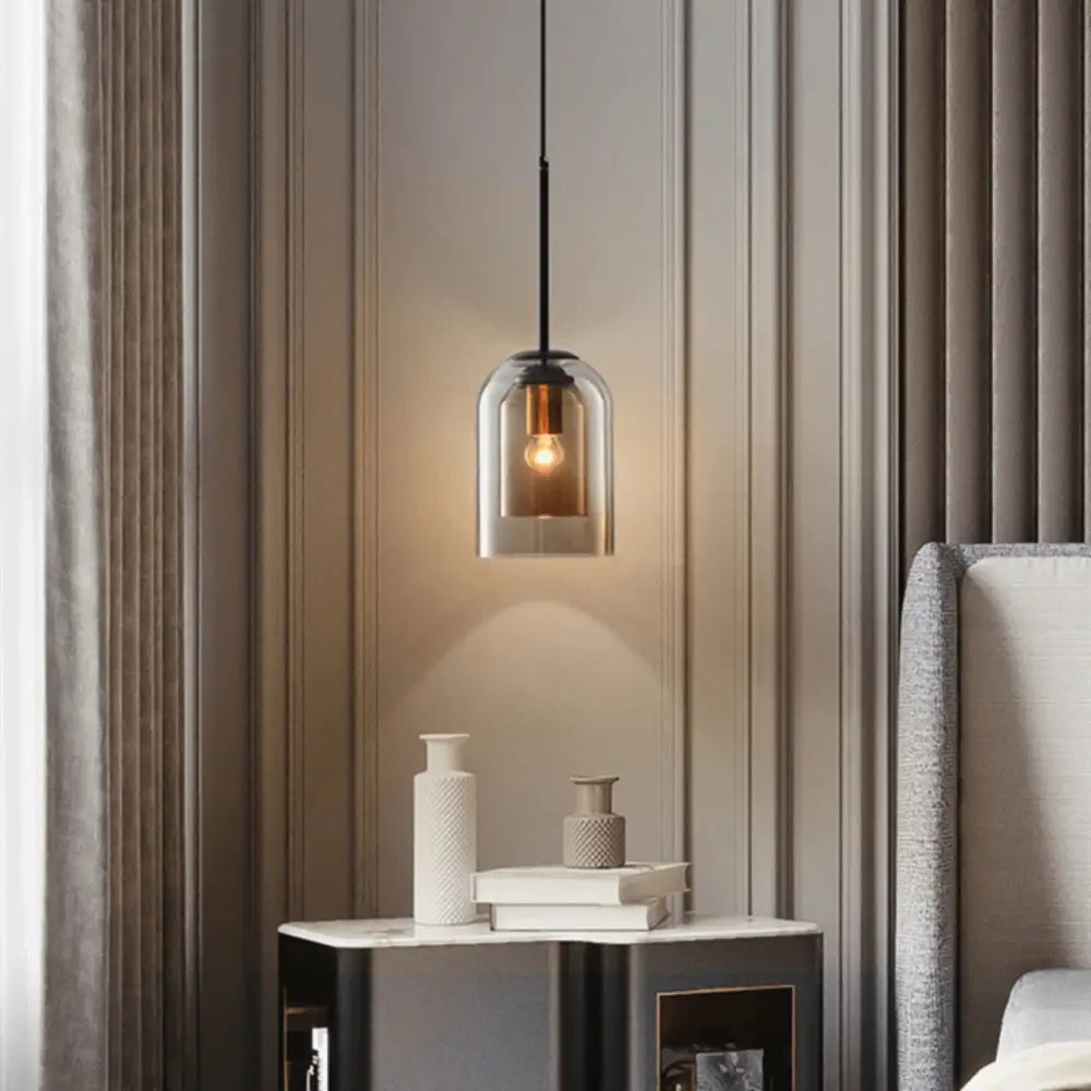 Decorbites™ nordic glass pendant lighting with a sleek bell-shaped smoked glass pendant and black metal frame hanging from a cord