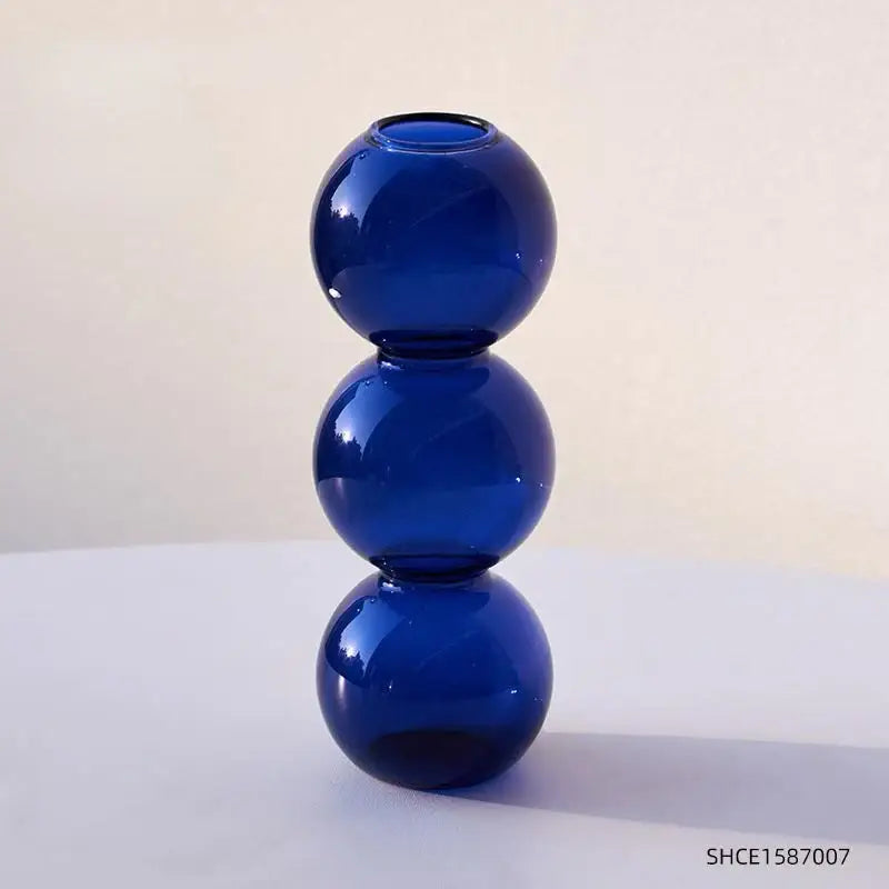 A sleek cobalt blue glass vase with three stacked spheres glossy finish nordic glass vase by DecorBites for home decor
