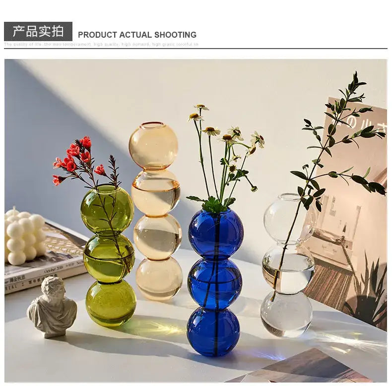Stacked spherical nordic glass vases in vibrant green amber and blue hues for home decoration gift by decorbites