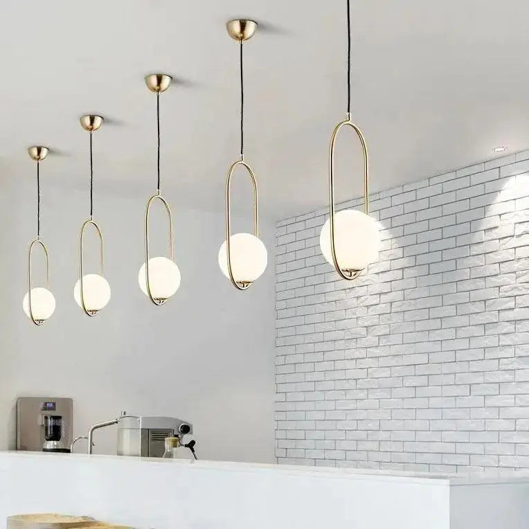 Decorbites nordic gold pendant light featuring modern brass oval frames with frosted glass shade globes