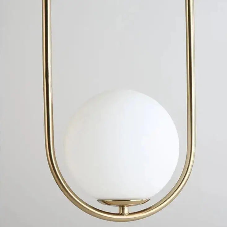 Decorbites™ nordic gold pendant light featuring a polished brass frame and smooth opaque white glass shade