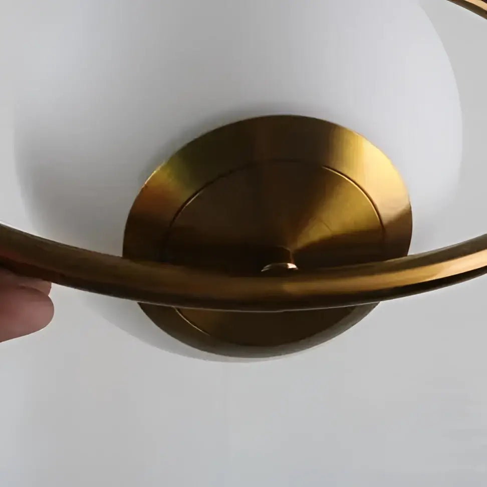 DecorBites™ nordic gold pendant light with a gold-toned metal frame and white dome-shaped glass shade