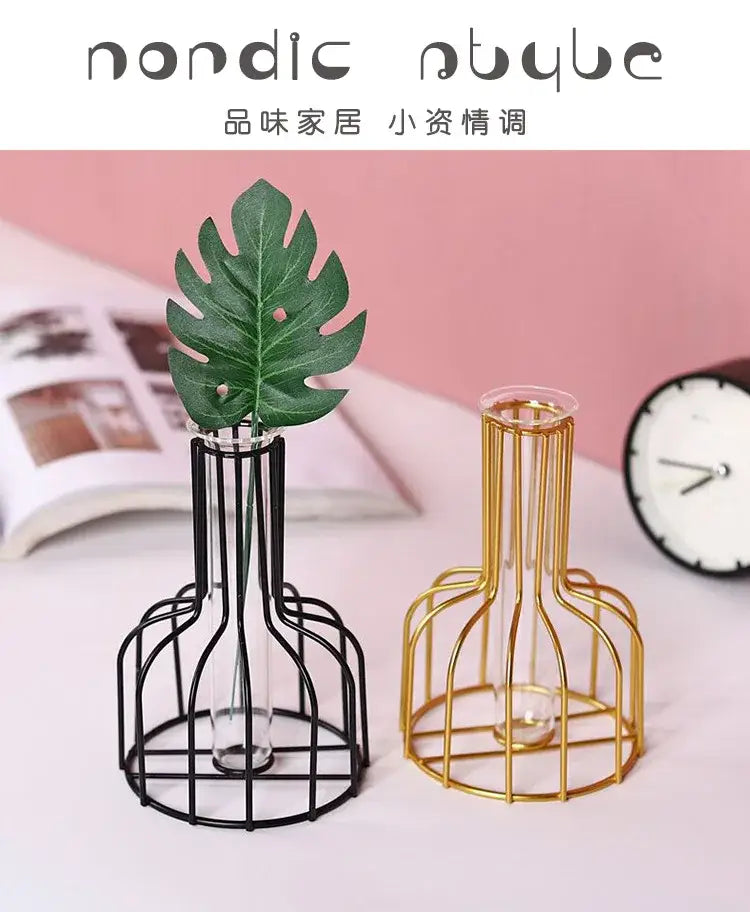 Decorbites nordic iron golden hydroponic vase featuring black and gold wireframe design with green monstera leaves