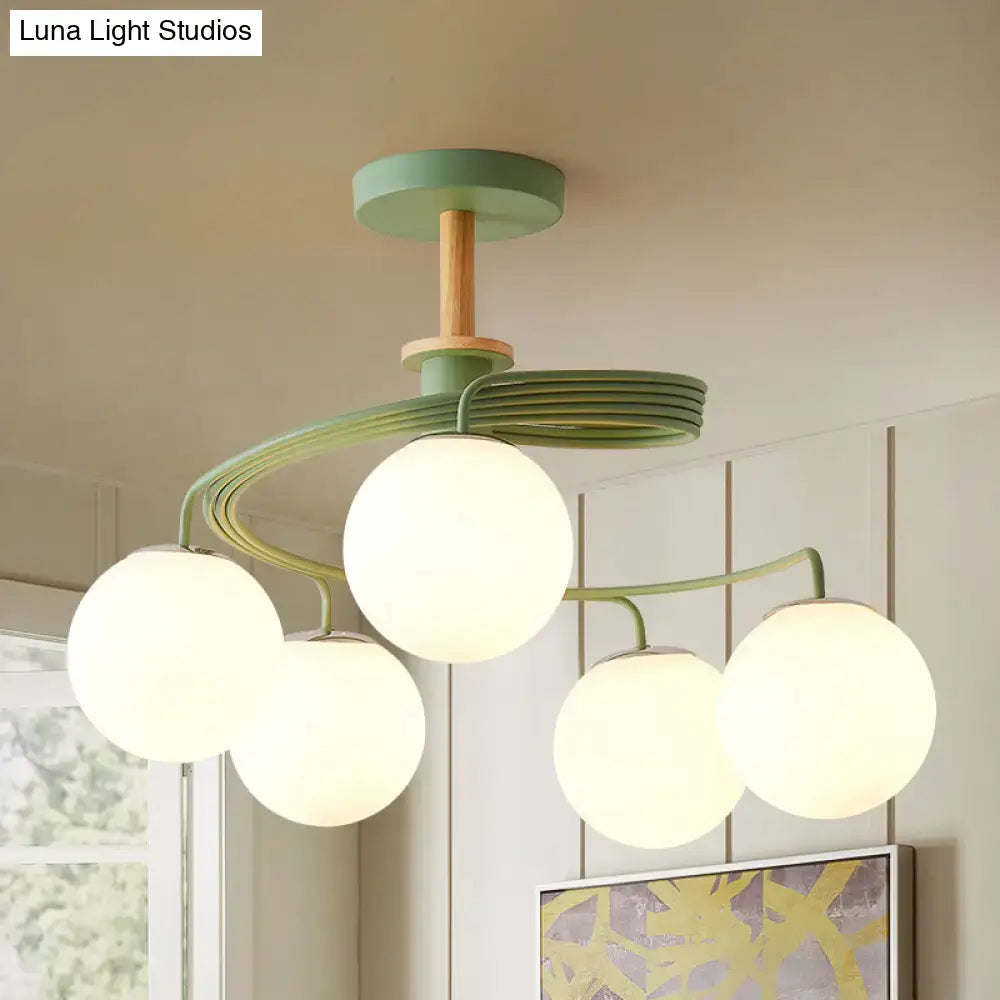 Modern mint green and wood-toned DecorBites Nordic flush chandelier with five orb glass shades and semi flush mount
