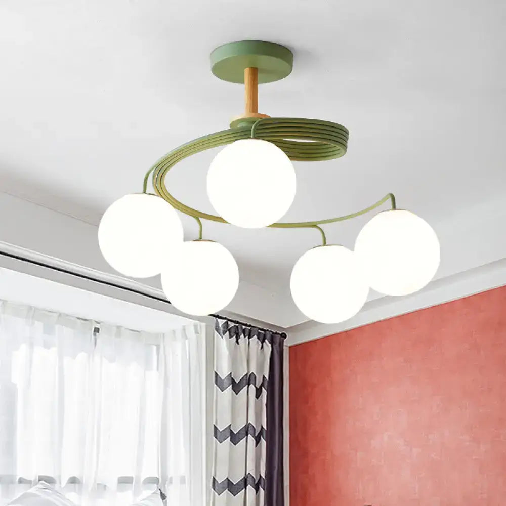 DecorBites Nordic iron swirl flush chandelier with five orb glass shades on green metal frame and wooden downrod