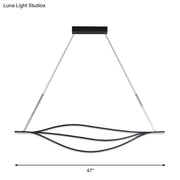 Modern black led lightbulb pendant light with curved metallic leaf-like strips suspended from silver cables