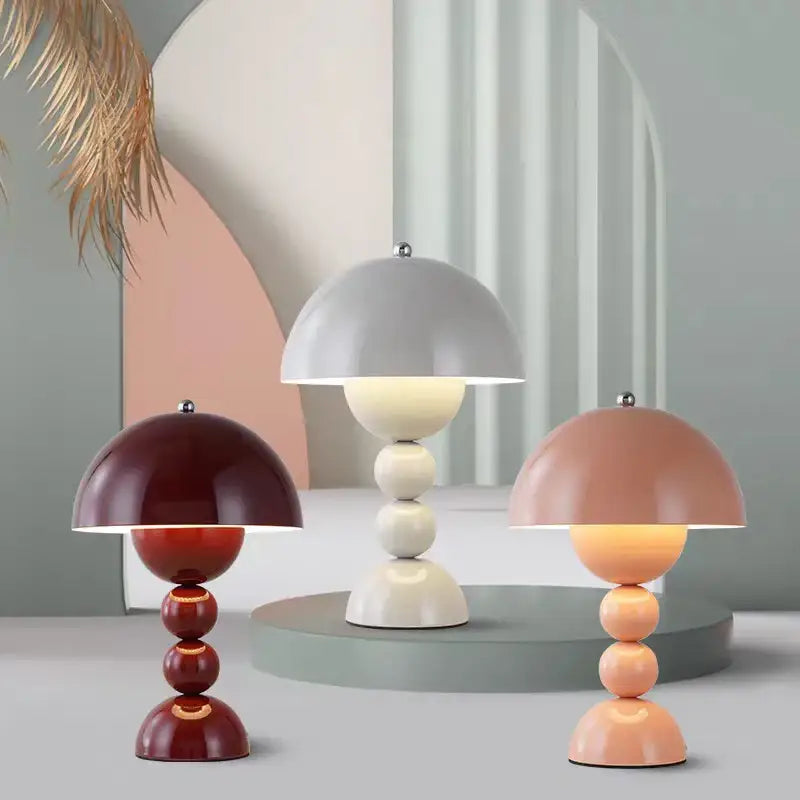 Three nordic led DecorBites table lamps with usb dimmable mushroom-shaped bases in burgundy cream and peach tones