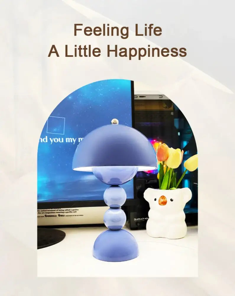 A sleek matte blue dome-shaped decorbites™ nordic led usb dimmable table lamp with stacked spherical bases for room decor