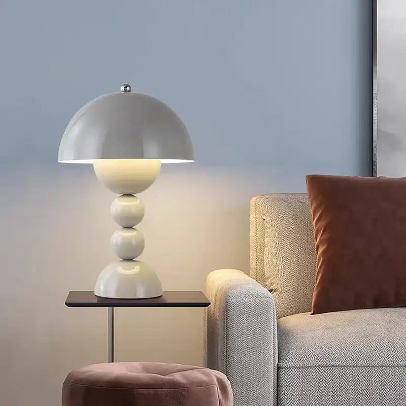 A sleek matte white table lamp with a nordic led usb dimmable design and stacked spherical base for bedroom decor