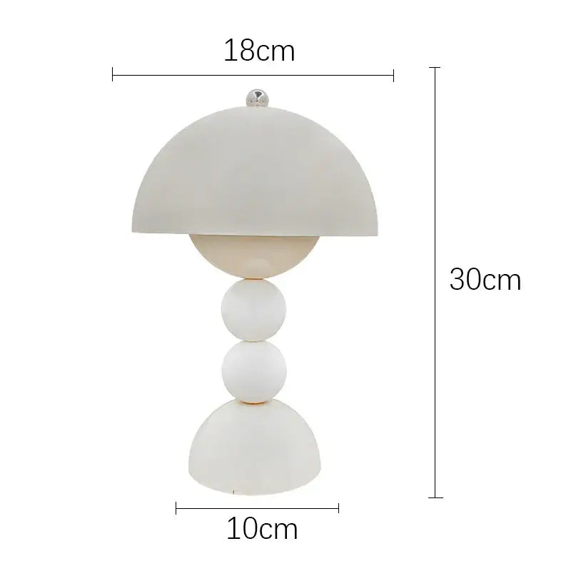 A modern white ceramic table lamp with dome shade and stacked spheres featuring usb dimmable nordic led lighting