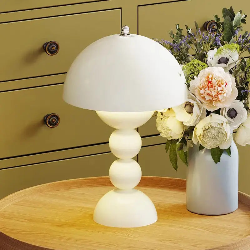A sleek white ceramic table lamp with dome shade and stacked spherical base featuring nordic led usb dimmable design