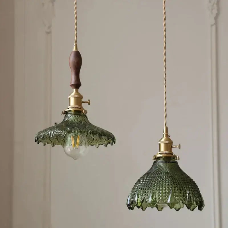 DecorBites Nordic led pendant light featuring green glass shades with brass hardware and wooden handles on a chain cord