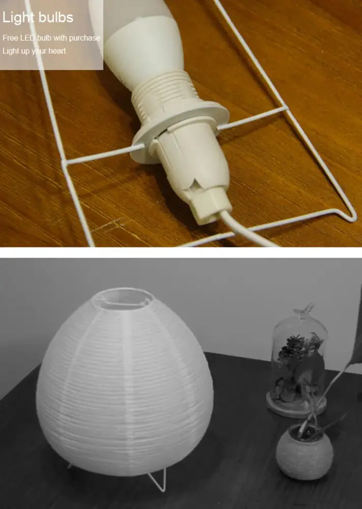 White paper lantern led table lamp with ribbed texture on three-legged metal stand for interior lighting and home decor