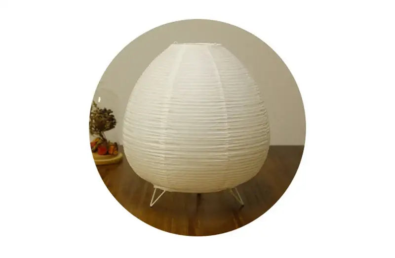 DecorBites Nordic led table lamp with white ribbed paper lantern shade and three slender metal legs for indoor use