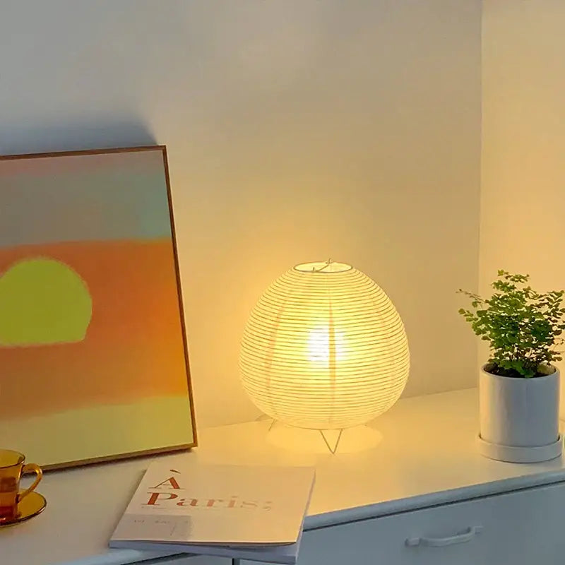 Warmly glowing decorbites™ nordic led table lamp with ribbed spherical paper lantern and delicate wire stand for home decor