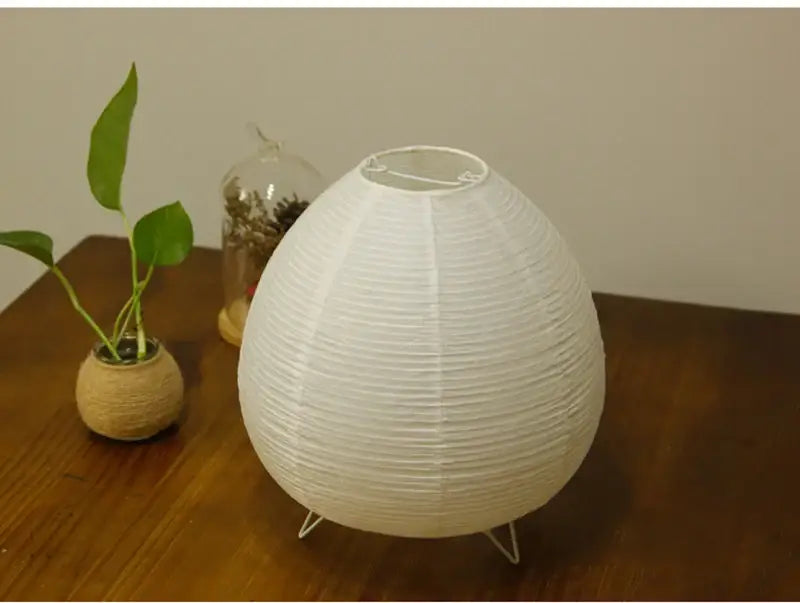 DecorBites Nordic led table lamp featuring a white ribbed paper lantern with three wire legs for home decor