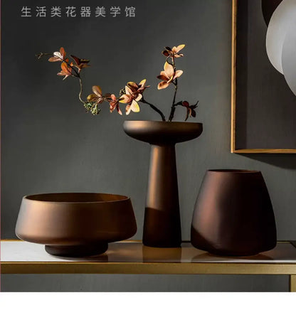 Decorbites™ nordic luxe frosted glass vase with bronze-toned ceramic base holding dried orchid branches