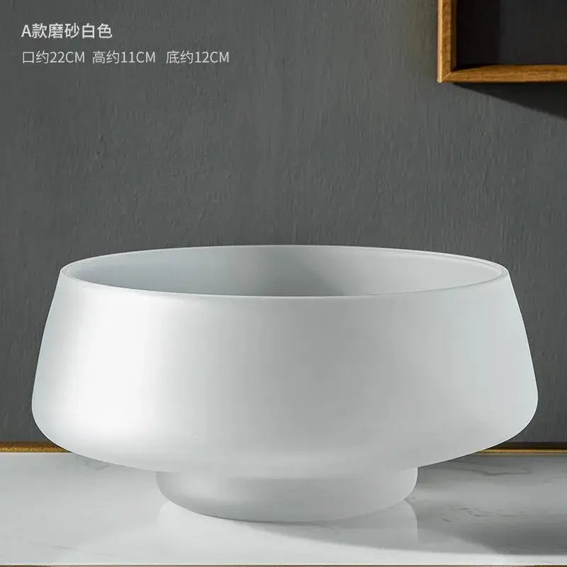 A matte white ceramic bowl with a wide curved rim featured alongside decorbites™ nordic luxe frosted glass vase decoration