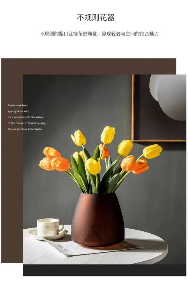 Decorbites™ nordic luxe frosted glass vase in matte brown holds vibrant yellow and orange tulips as table decoration