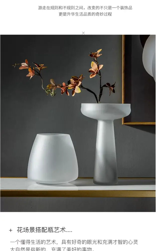 A sleek frosted glass vase by decorbites with a modern pedestal base and wide opening in white ceramic finish