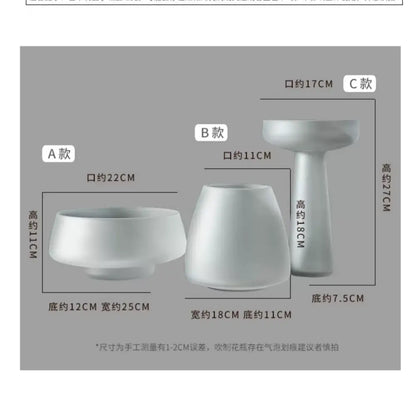 Three white ceramic DecorBites™ nordic luxe frosted glass vases featuring varied shapes for table decoration