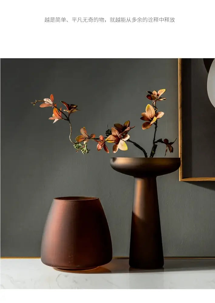 Decorbites™ nordic luxe features two matte ceramic vases beside a frosted glass vase table decoration in warm terracotta and dark bronze