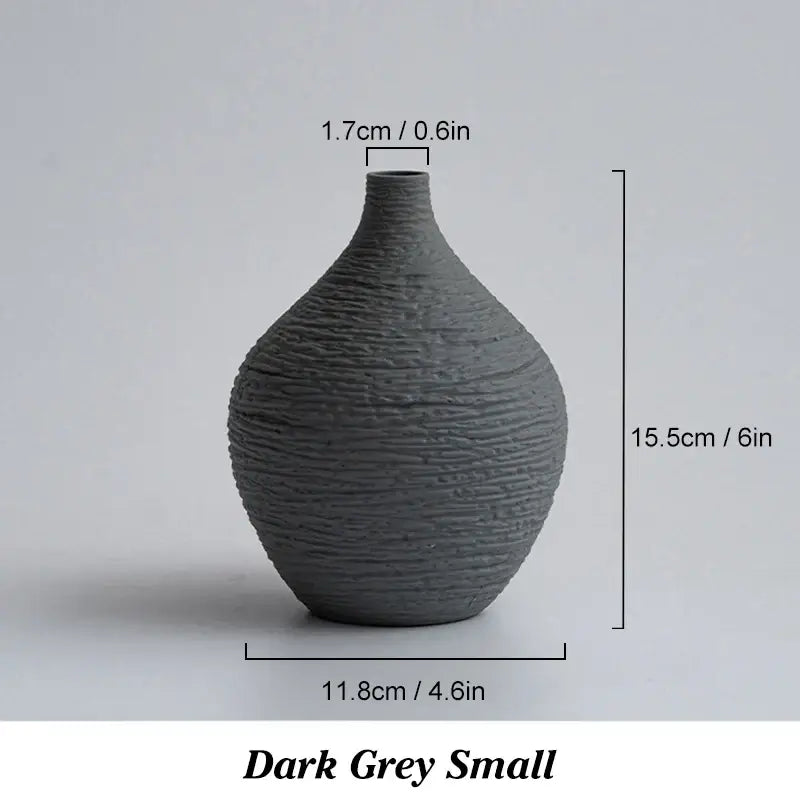 Dark grey ceramic vase with textured ribbed surface and narrow neck from decorbites nordic luxury ceramic collection
