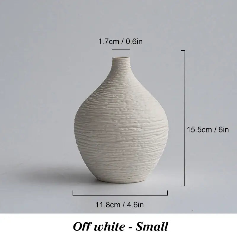 Off-white ceramic vase with textured ribbed surface and rounded shape for nordic luxury ceramic home décor by decorbites