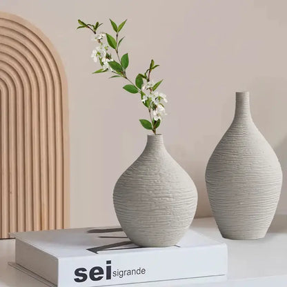 Two off-white textured ceramic vases with ribbed surfaces from decorbites nordic luxury ceramic vase collection for home décor