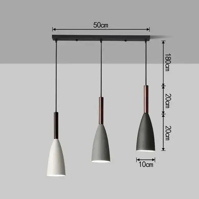 Modern three-light pendant light with black metal bar, matte white and gray shades, copper accents for kitchen island lighting