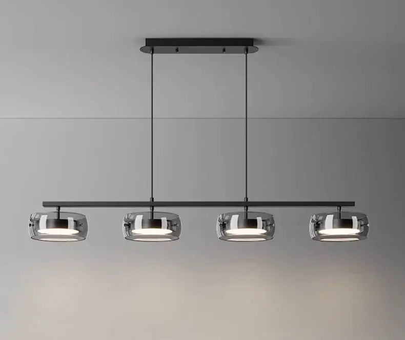 Modern black metal pendant lamp with four clear glass globes for dining and living rooms with cold white or warm white options