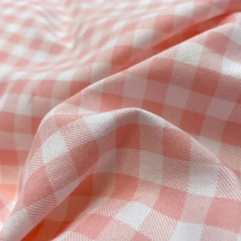 Soft pink and white nordic plaid cotton bedding set with subtle woven texture for queen and king beds