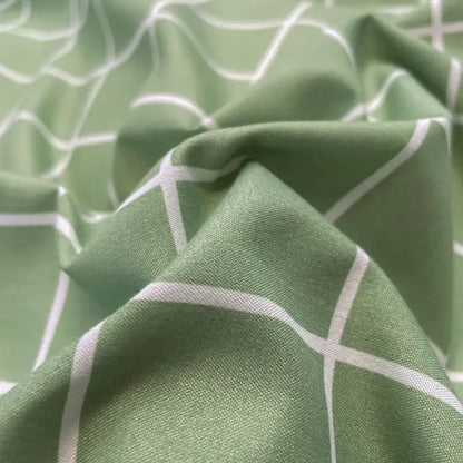Soft sage green cotton bedding set with subtle white geometric lattice pattern from DecorBites™ nordic plaid collection
