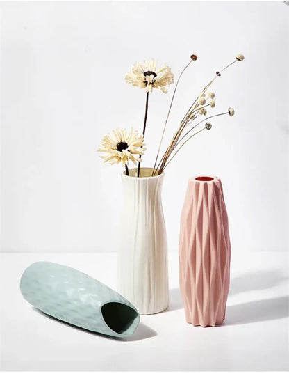 A sleek soft pink matte ceramic vase with geometric diamond pattern from decorbites nordic plastic vase collection