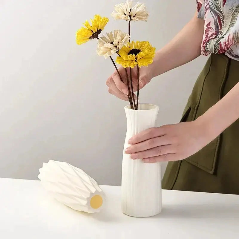 White ceramic nordic plastic vase with vertical ridges and flared rim for modern home decor by decorbites