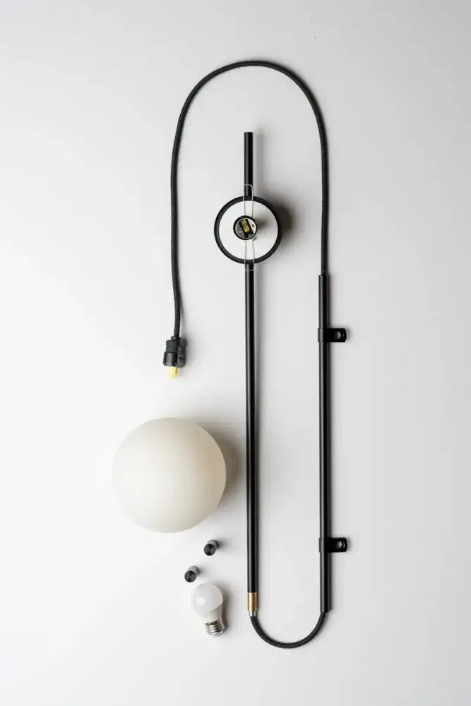 Decorbites nordic plug in wall lamp sconce featuring a black metal frame, curved cable, and off-white glass shade wall lamp sconce
