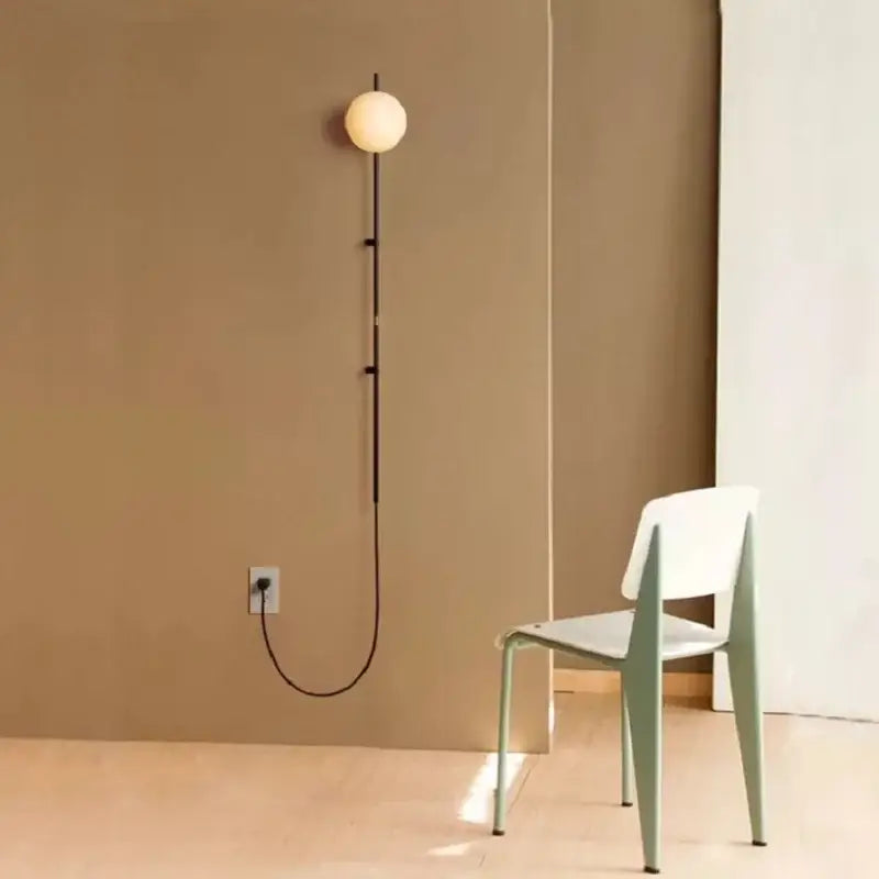 Minimalist DecorBites™ Nordic wall lamp sconce with spherical frosted glass bulb and slender black metal stem