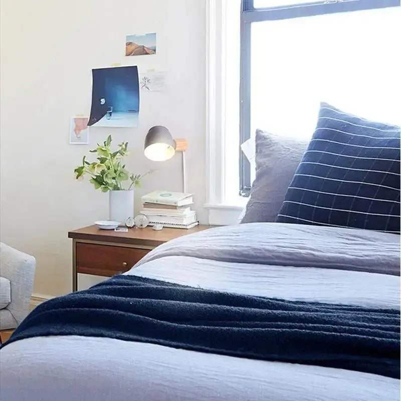 Decorbites™ nordic plug in wall sconce with a sleek matte black shade and slender metallic base wall light