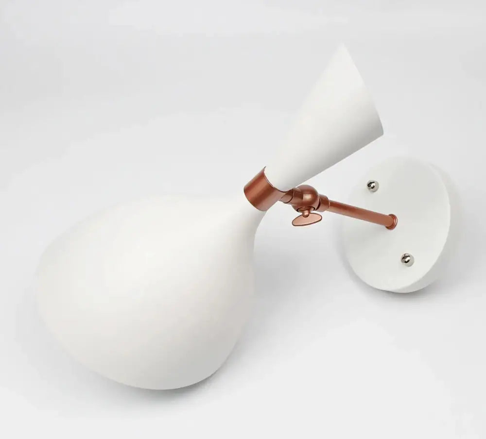 DecorBites™ nordic plug-in wall sconce with white matte finish and copper articulated arm for easy installation and compact size makes it ideal