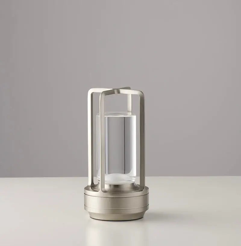 Modern minimalist nordic rechargeable table lamp with brushed stainless steel frame and clear glass cylinder base
