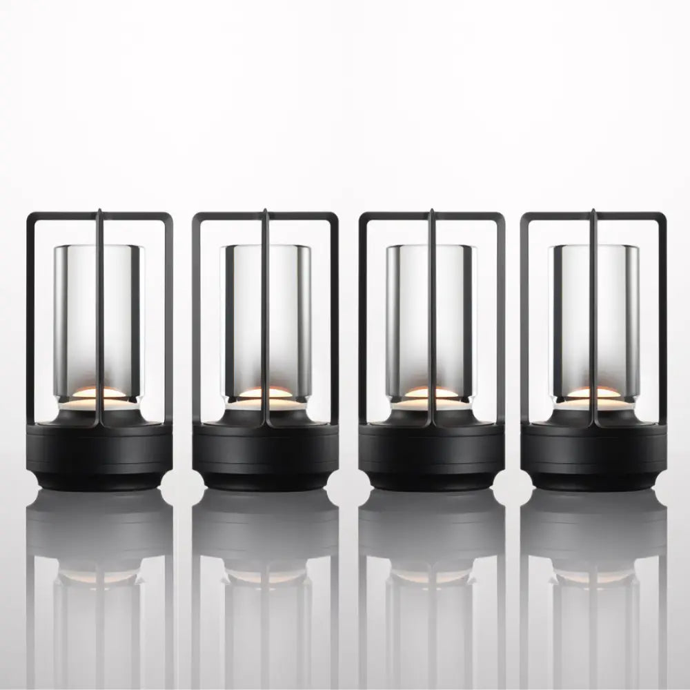 Black-framed DecorBites™ nordic rechargeable table lamp with frosted glass cylinders and warm LED lights