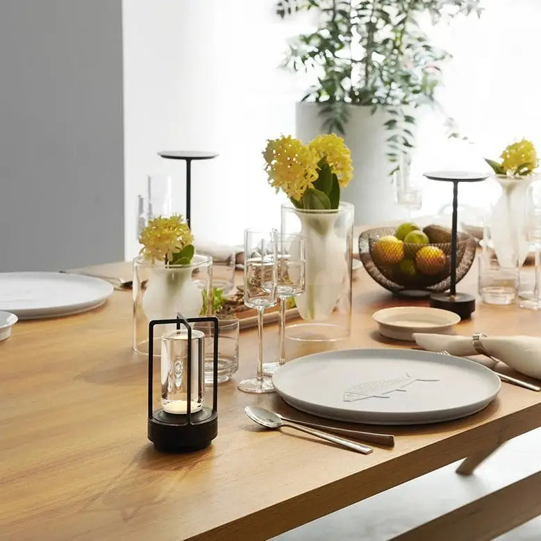 Decorbites™ nordic rechargeable table lamp with black metal lantern, clear glass, and lit candle inside for ambient lighting