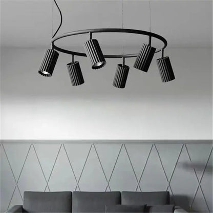 Black circular DecorBites™ Nordic rotatable circle chandelier with five ribbed cylindrical fixtures for dining and kitchen