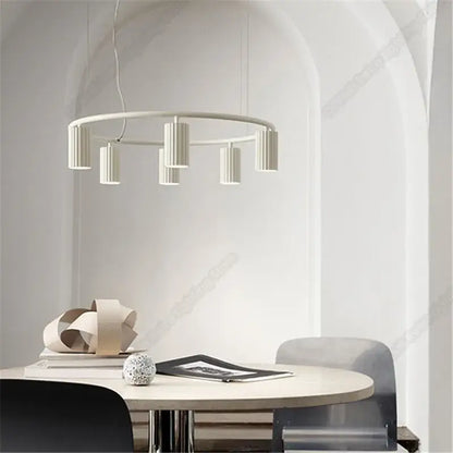 Modern white circular pendant light with cylindrical fixtures by decorbites™ nordic donna circle chandelier for dining and kitchen