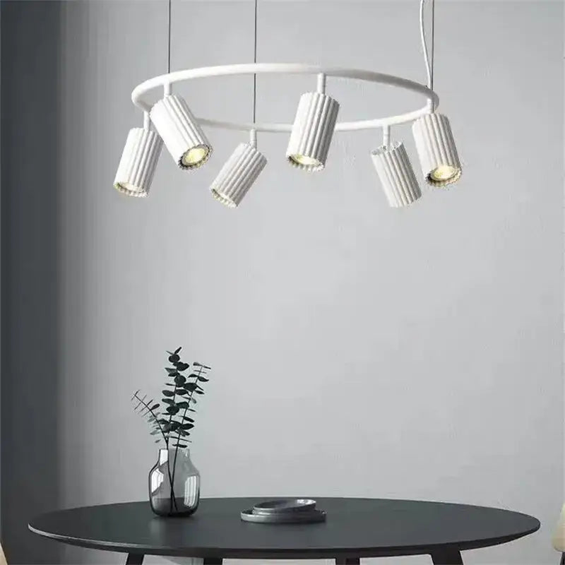 White circular donna circle chandelier with six ribbed cylindrical fixtures for dining and kitchen lighting